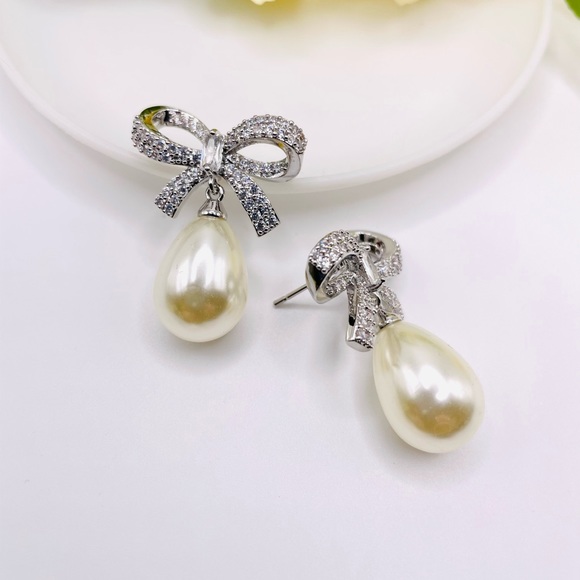 Anthro Shashi Pave Pearl Bow Earrings - Picture 4 of 6